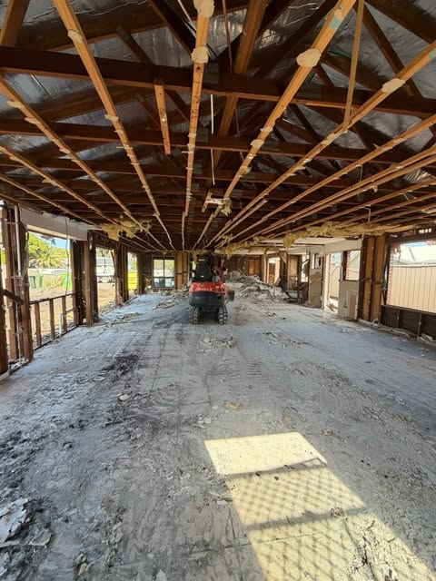 Inside a house with wall linings and fittings removed during a strip out